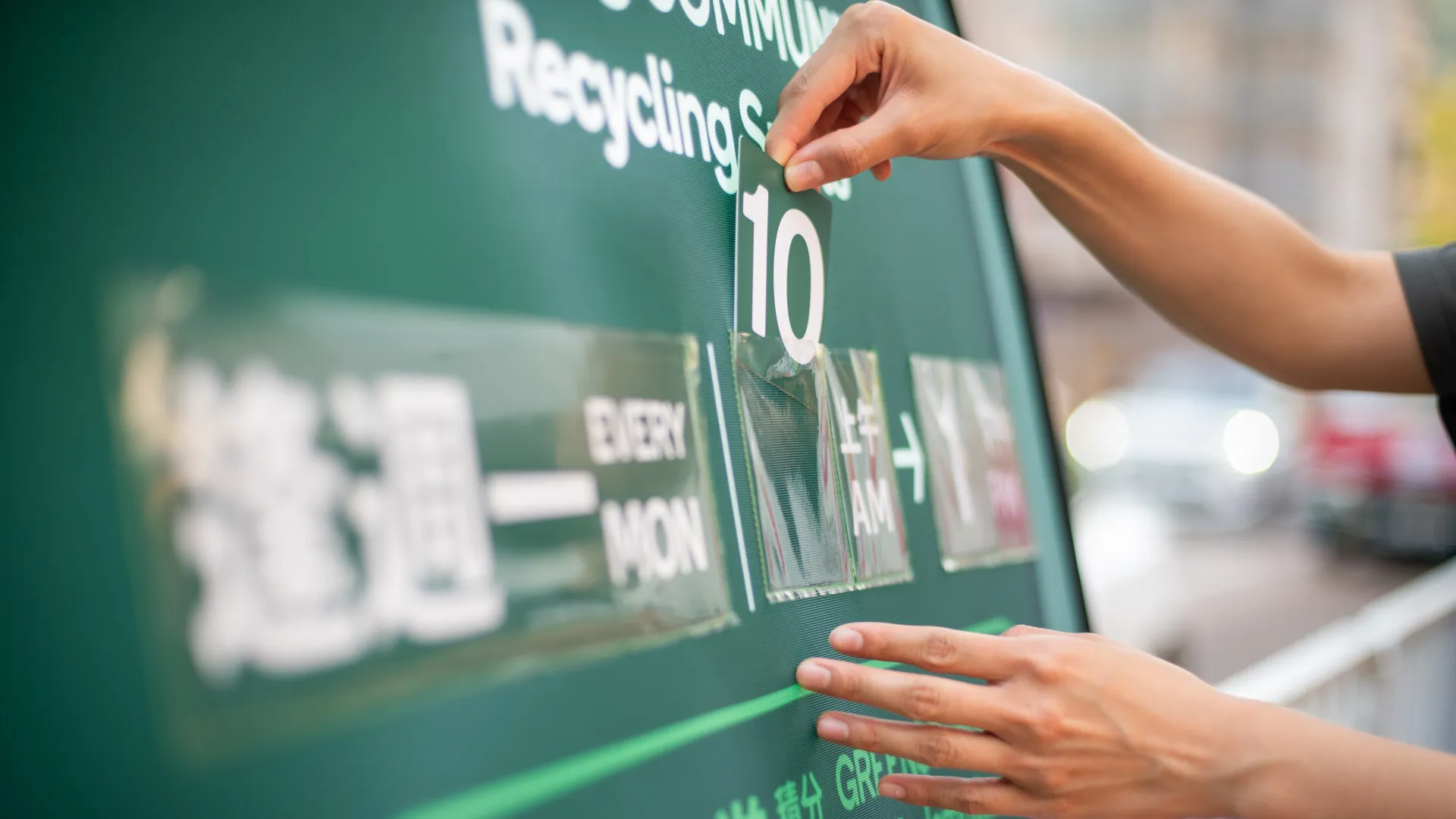 Operating hours of Recycling Spot is shown on roll-up banner